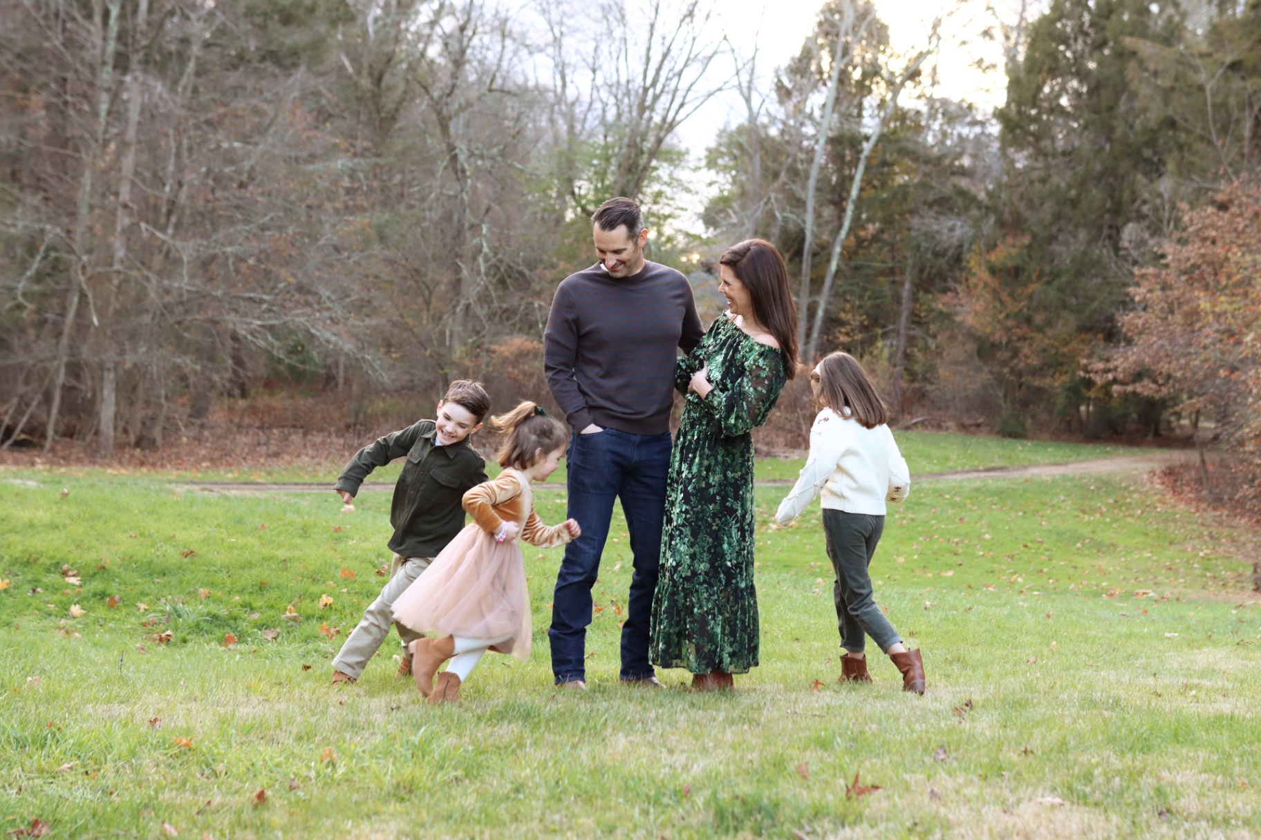 Caitlin and Evan Blais with their three children in a field